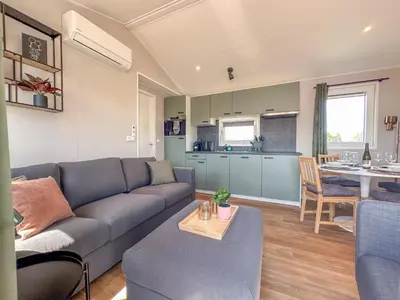 a living room with a couch and a table at Fuut 24-26 in Breukelen
