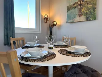 a dining room table with glasses and dishes on it at Fuut 24-26 in Breukelen