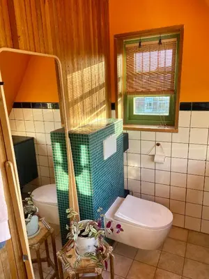 a bathroom with a toilet and a sink at House next to Amsterdam in Landsmeer