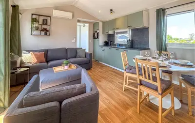 a living room with a couch and a table at Gorgeous Home In Breukelen With House Sea View in Breukelen