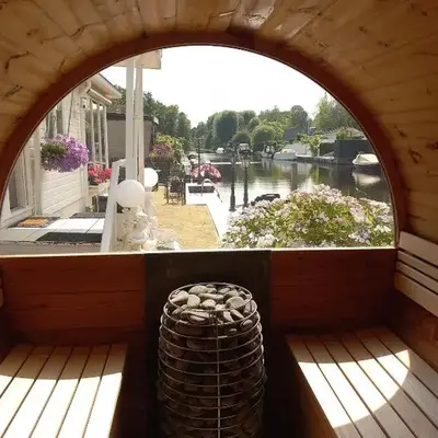 Chalet with waterfront sauna and boat