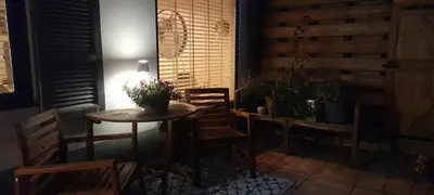 a room with a table and chairs with plants on it at Eeden in Noordwijk aan Zee