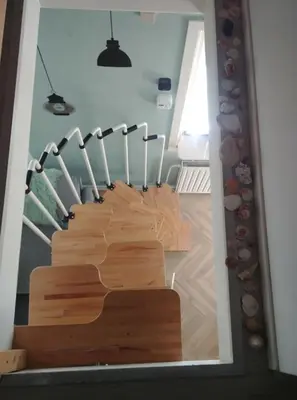 a group of knives lined up in a stair case at Eeden in Noordwijk aan Zee