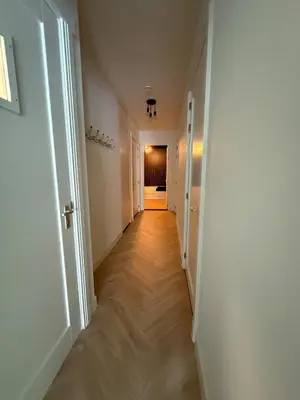 a hallway of an apartment with a long corridor at The Blue House in Alkmaar