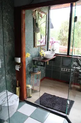 a bathroom with a glass shower and a sink at Temple of Hedon Wellness Spa and Sleep in Ankeveen