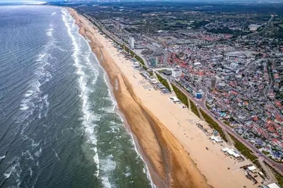 an aerial view of a beach and the ocean at The Dune house, Free parking in Zandvoort