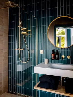a bathroom with a sink and a mirror at Suites aan de Gracht Utrecht in Utrecht