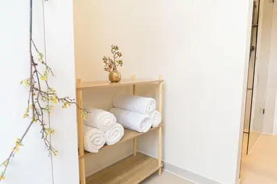 a shelf filled with towels in a bathroom at Charming Jordaan Apartment, Canal Views in Amsterdam