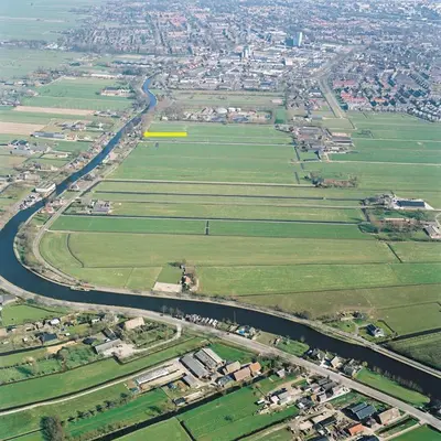 an aerial view of a field and a road at Guesthouse Het Woerdense Veerhuis in Woerden