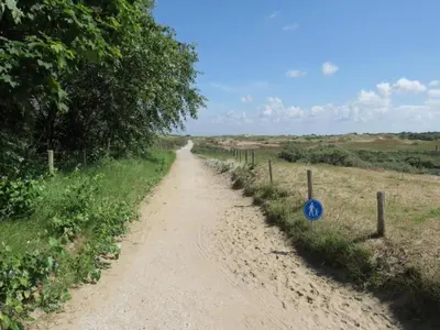 a dirt road in the middle of a field at Holiday Home near Dutch Coast & Forest in Noordwijk