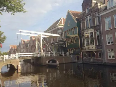a group of buildings and a bridge over a canal at Holiday apartment in Alkmaar in Alkmaar