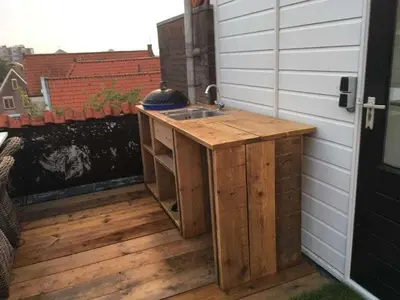 a sink on the back of a patio at Holiday apartment in Alkmaar in Alkmaar