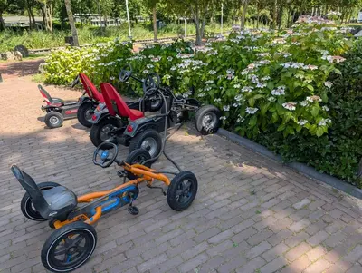 a group of four four wheelers parked on a brick sidewalk at Holiday House 4 guests at Spaarnwoude in Velsen-Zuid