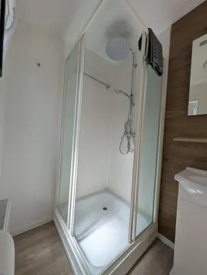 a shower with a glass enclosure in a bathroom at Holiday House 4 guests at Spaarnwoude in Velsen-Zuid