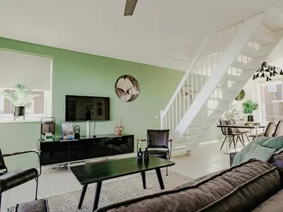 a living room with a couch and a table at Nova Meer in Uitgeest