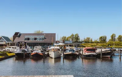 a bunch of boats are docked in a marina at Westergeest Beneden 2 Slaapk in Uitgeest