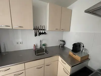a kitchen with a sink and a counter top at Casa Luz & Luna in Akersloot