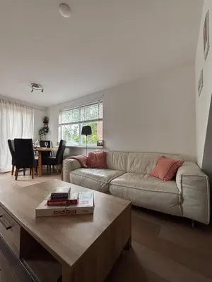 a living room with a couch and a coffee table at Casa Luz & Luna in Akersloot