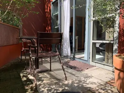 two chairs sitting at a table in front of a window at Zocher6 a monumental town house in the city center in Utrecht