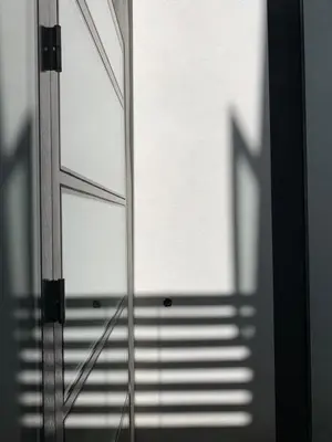 a glass door with a shadow of a staircase at Zocher6 a monumental town house in the city center in Utrecht