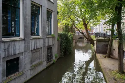 a body of water next to a building at Zocher6 a monumental town house in the city center in Utrecht