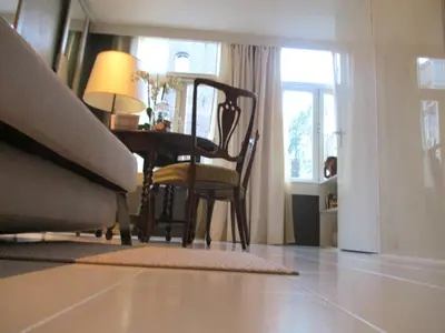 a living room with a table and a chair at Miss Jordaan for Quiet Travellers in Amsterdam