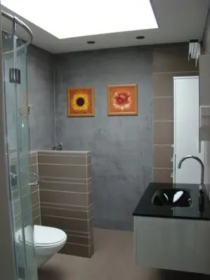 a bathroom with a toilet and a shower and a sink at Fewo Klimduin Castricum in Castricum
