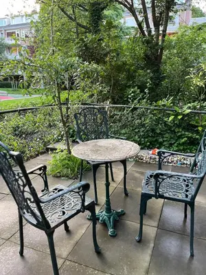 two chairs and a table and a table and chairs at Garden Apartment, Amsterdam in Amsterdam