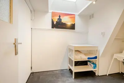a small room with a cross on the wall at Large Family House Alkmaar in Alkmaar