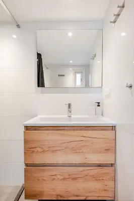 a bathroom with a sink and a mirror at Large Family House Alkmaar in Alkmaar