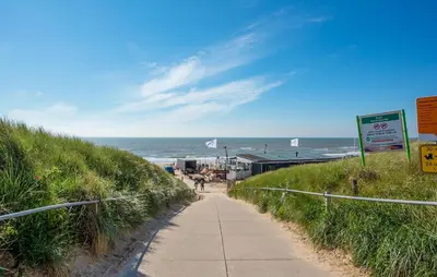a path along a beach with the ocean in the background at Cozy Home In Bergen Aan Zee With Wifi in Bergen aan Zee