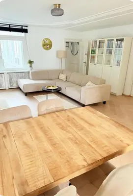 a living room with a couch and a table at Canal House The Manor in Amsterdam