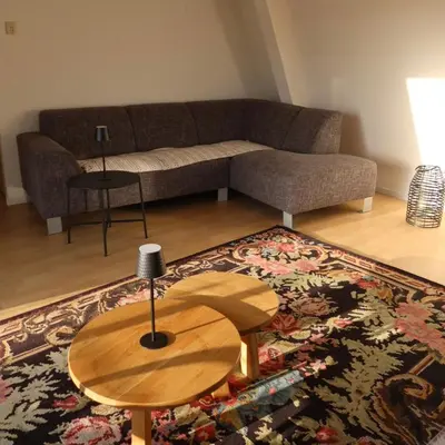 a living room with a couch and a table at Viva la Vida in Bergen