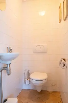 a bathroom with a toilet and a sink at T Pronkhuis in Egmond aan Zee