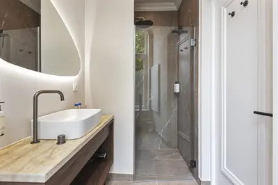 a bathroom with a sink and a shower at Boutique hotel Novi in Zandvoort