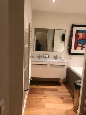 a bathroom with a sink and a mirror at Treasure in Amsterdam