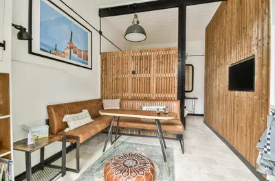 a living room with a couch and a table at Studio Pien Zandvoort in Zandvoort