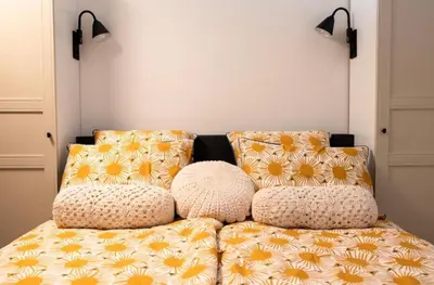 a couch with pillows on it in a room at Studio Pien Zandvoort in Zandvoort