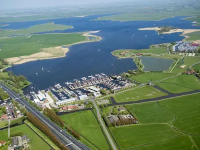 an aerial view of a river and a city at Apartment Westergeest 2 by Interhome in Uitgeest