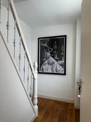 a staircase with a picture of a man on the wall at Boutique LaBeau in Amsterdam