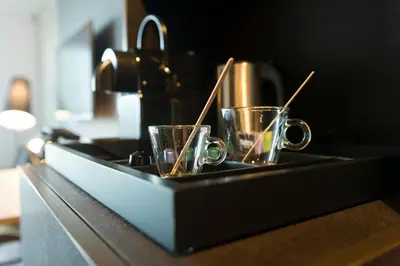 a tray with two cups and chop sticks in it at Jaz in the City Amsterdam in Amsterdam