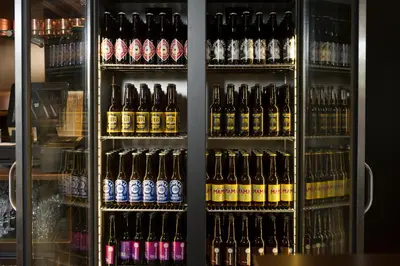 a display case filled with lots of bottles of beer at Jaz in the City Amsterdam in Amsterdam