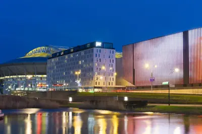 a large building in front of a building at Jaz in the City Amsterdam in Amsterdam