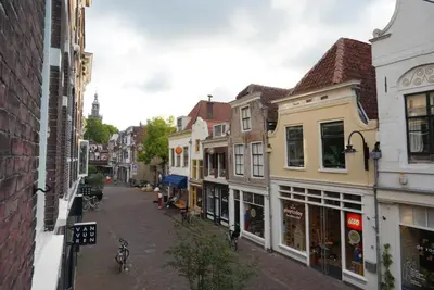 an empty street in a city with buildings at De Verwondering Privé etage met 2 slaapkamers in Gouda