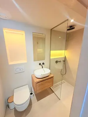 a bathroom with a toilet and a sink and a shower at History and luxury in Amsterdam