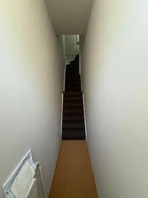 a stairway with a stair case in a building at History and luxury in Amsterdam