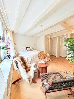 a living room with a bed and a couch at History and luxury in Amsterdam