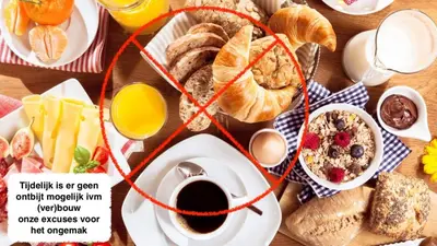 a table with breakfast foods and coffee on it at B&Boerderij De Veldmuis in Eemdijk