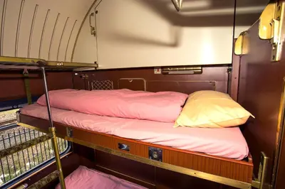 a couple of bunk beds on a boat at Train Lodge Amsterdam in Amsterdam