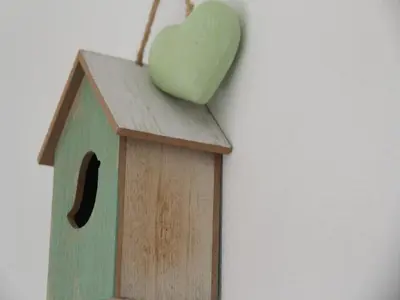 a bird house with a heart on top of it at Pet-Friendly Bungalow in Warmenhuizen